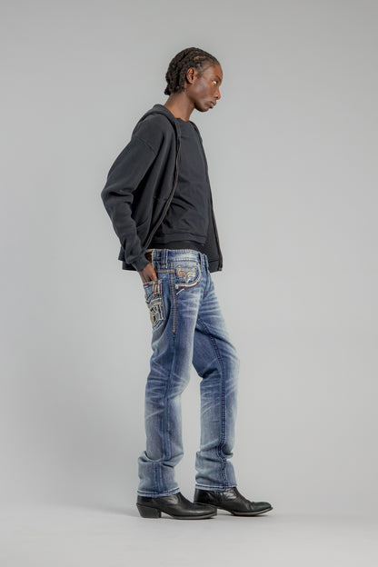Person wearing blue jeans and a dark hoodie on a plain background