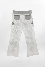 (JWL5808)Pantalones de chándal de tiro bajo Rock Revival by Jaded London con estampado gráfico en blanco