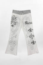 (JWL5808)Pantalones de chándal de tiro bajo Rock Revival by Jaded London con estampado gráfico en blanco