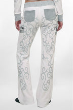 (JWL5808)Pantalones de chándal de tiro bajo Rock Revival by Jaded London con estampado gráfico en blanco